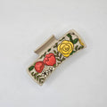 Hand-painted wood hair claw clip featuring a floral burst design with yellow roses, red poppies, and white wildflowers with green leaves on a natural wood background