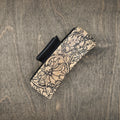 Hand-stained wood hair claw clip featuring a laser-engraved western wild rose with intricate scrollwork on a natural wood background