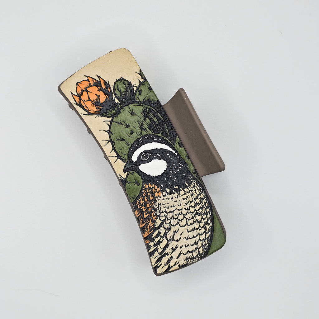 Hand-painted wood hair claw clip featuring a Northern Bobwhite quail and prickly pear cactus