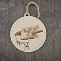 Laser engraved Black-tailed Gnatcatcher wood ornament, featuring a detailed bird illustration perched on a leafy branch, hung with natural jute cord
