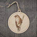 Laser engraved Indigo Bunting wood ornament with detailed engraved illustration, hung with natural jute cord