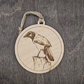 Laser engraved Green Jay wood ornament, featuring a detailed illustration of this bold South Texas bird perched on a wooden post, hung with natural jute cord
