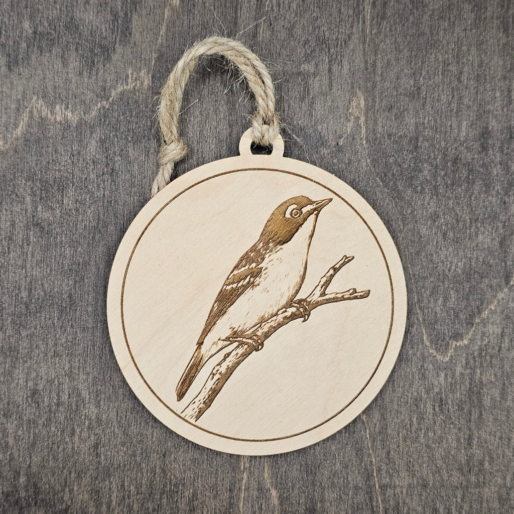 Laser engraved Black-capped Vireo wood ornament, featuring a detailed illustration of this federally protected songbird perched on a branch, hung with natural jute cord