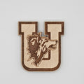 Laser-engraved wood magnet shaped like a varsity letter U with howling wolf mascot silhouette