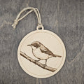 Laser engraved Hybrid Parula wood ornament, featuring a detailed bird illustration perched on a textured branch, hung with natural jute cord