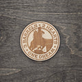 Round laser-engraved wood magnet with barrel racer and horse silhouette, reading 3 Barrels 2 Hearts One Dream
